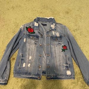 Distressed jean jacket with roses